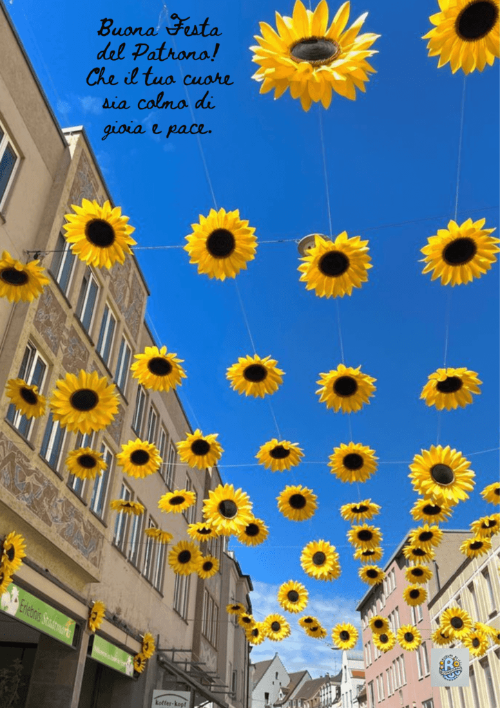Una strada vivace adornata di girasoli, che celebra la Festa Patronale, portando gioia e pace alla comunità